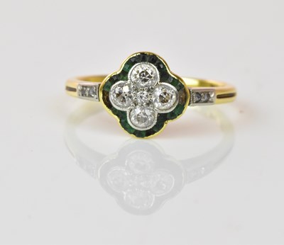 Lot 1304 - An early 20th century 18ct yellow gold emerald...