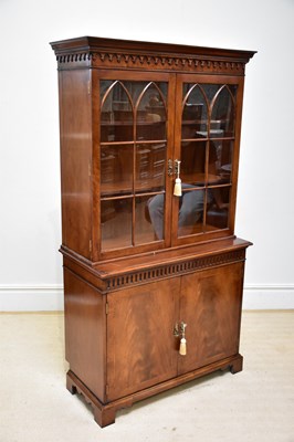 Lot 60 - A reproduction mahogany bookcase, with glazed...