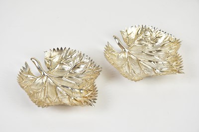 Lot 426 - A pair of white metal dishes modelled as...