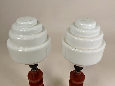 Lot 720 - A pair of amber bakelite Art Deco lamps with...