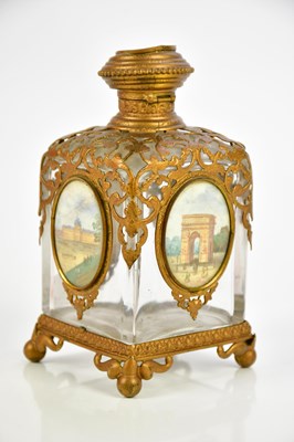 Lot 408 - A gilt metal and hand painted porcelain plaque...