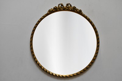 Lot 77 - A gilt framed circular wall mounted mirror,...