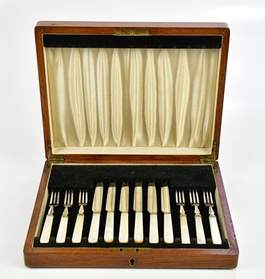 Lot 570 - A cased set of six plated knives and forks...