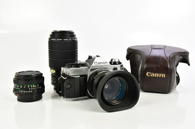 Lot 1185 - CANON; a Canon AE-1 program 35mm film camera,...