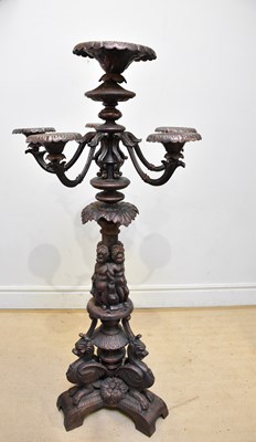 Lot 250 - A large cast iron floor standing five branch...