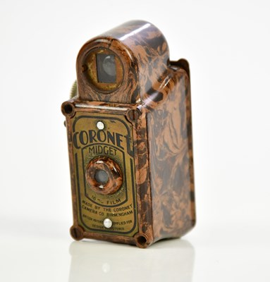 Lot 1186 - A Coronet Midget miniature camera, in mottled...