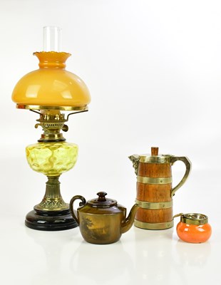 Lot 643 - A brass oil lamp with yellow shade, an oak and...