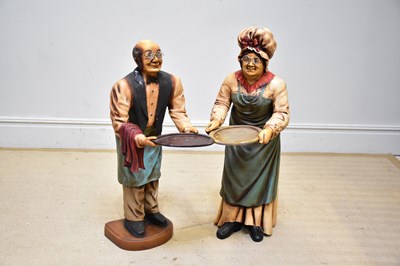 Lot 281 - Two modern fibreglass dumb waiters modelled as...