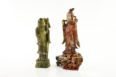 Lot 1163 - A Chinese hardstone model of an elder with...