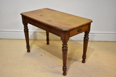 Lot 107 - An old pine side table with single end drawer,...