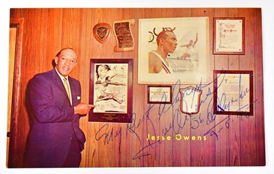 Lot 415 - JESSE OWENS; a colour postcard 'World's...