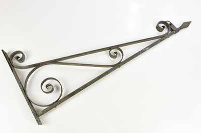 Lot 556 - A cast metal street sign hanger, length 93cm.