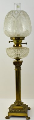 Lot 111 - A tall glass and brass paraffin lamp, the...