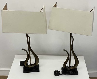 Lot 722 - A pair of contemporary table lamps with 'half'...