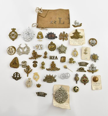 Lot 1295 - A collection of assorted cap badges including...