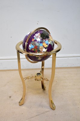 Lot 317 - A modern freestanding globe on brass framed...