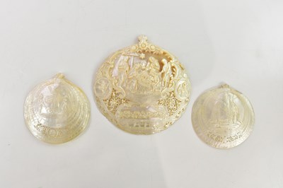 Lot 412 - Three carved mother of pearl shells, the...