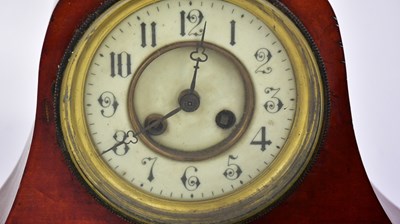 Lot 707 - An early 20th century oak Napolean hat shaped...