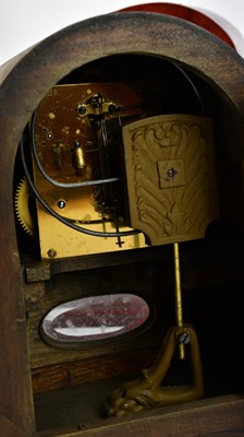 Lot 707 - An early 20th century oak Napolean hat shaped...