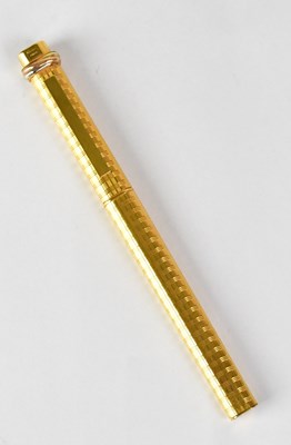 Lot 552 - CARTIER; a cased gold-plated ballpoint pen,...