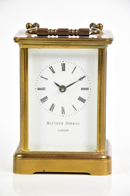 Lot 710 - MATTHEW NORMAN: a modern brass carriage clock,...