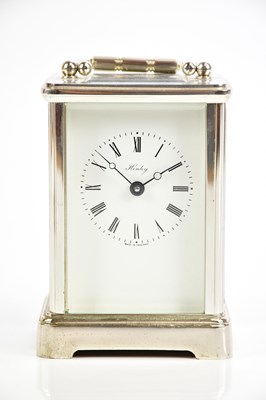 Lot 711 - HENLEY; a modern silver plated carriage clock,...