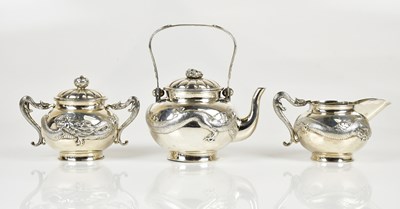 Lot 1122 - A Chinese Export silver three-piece tea...