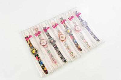 Lot 992 - Seven boxed Barbie watches.