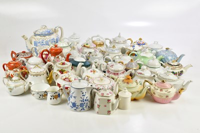 Lot 841 - A large collection of decorative teapots...