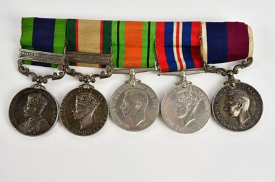 Lot 1280 - A group of five WWII and other medals awarded...