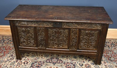 Lot 2961 - An 18th century carved and panelled oak coffer...