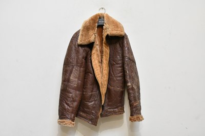 Lot 1240 - An RAF leather and sheep skin flying jacket.