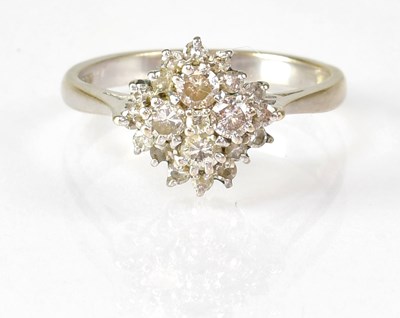 Lot 786 - An 18ct white gold diamond cluster ring, size...