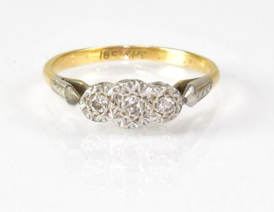 Lot 783 - An 18ct gold and platinum ring set with three...