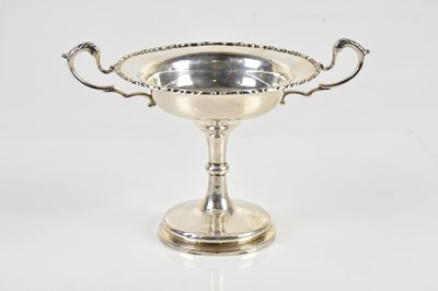 Lot 431 - An early 20th century white metal twin handled...