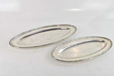 Lot 319 - LEITAO & LR; two white metal oval dishes, with...