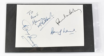 Lot 268 - WINGS; a signed card signed by members of the...