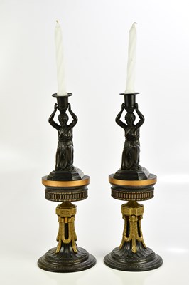 Lot 498 - A pair of decorative bronzed metal figural...