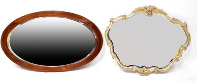 Lot 111 - An Edwardian inlaid mahogany oval wall mirror...