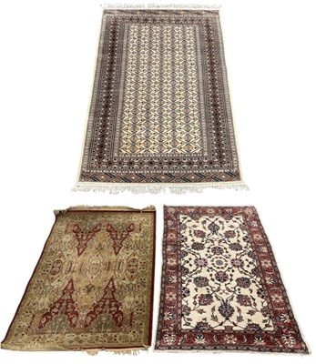 Lot 97 - A Persian hand woven cream ground carpet with...