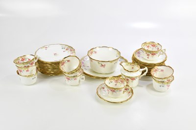 Lot 842 - A white ground floral decorated part tea...