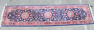 Lot 301 - An Eastern style runner, with stylised floral...