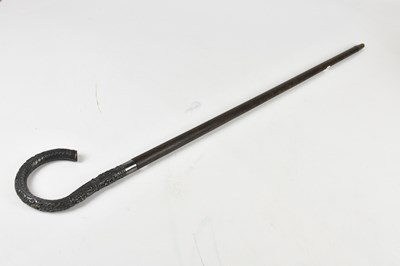 Lot 1249 - A rosewood walking cane, with Thai white metal...