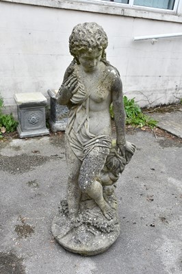 Lot 285 - A composite stone garden statue of a standing...