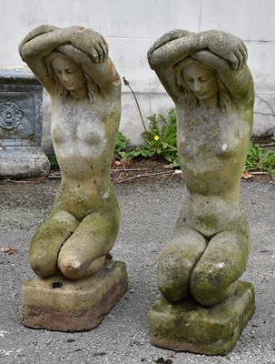 Lot 284 - A pair of composite stone garden statues of...