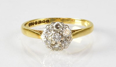 Lot 784 - An 18ct yellow gold diamond floral cluster...