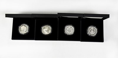 Lot 771 - THE ROYAL MINT; four silver proof coins...