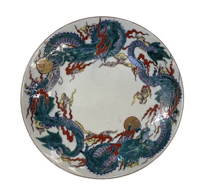 Lot 548 - A Chinese porcelain plate, with doucai dragon...