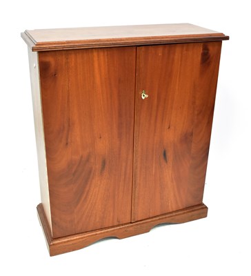 Lot 100 - A wooden two-door coin cabinet with dividing...