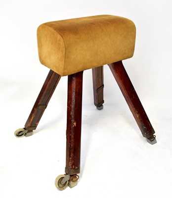 Lot 375 - A vintage pommel horse raised on wooden legs,...